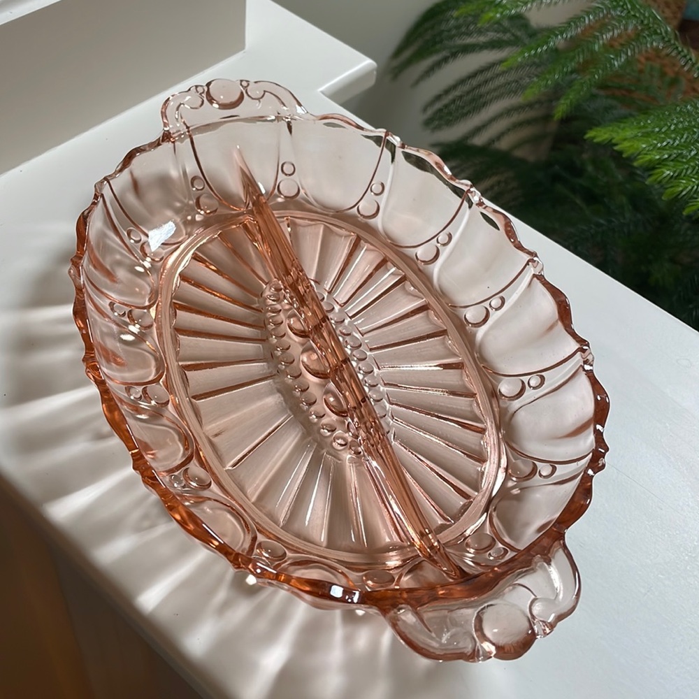 Vintage pink depression glass oval divided serving dish.